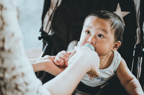 baby taking a bottle