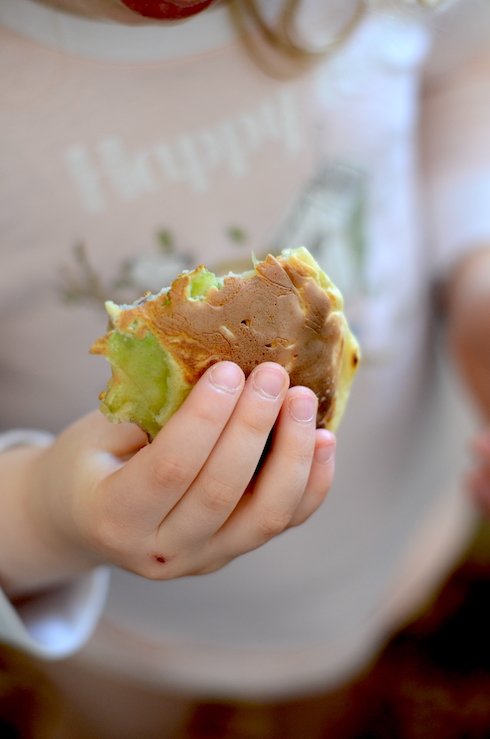 toddler eating veggie fritters