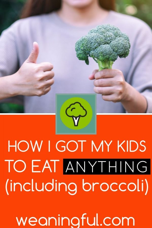 Woman holding a broccoli floret and giving the thumbs up. This is the first part of a series of posts on how to get a child to eat.